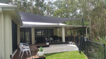 A grey patio shade sail over entertaining area at a clients home in North Brisbane